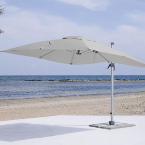 Commercial cantilever umbrella with silver canopy and frame.